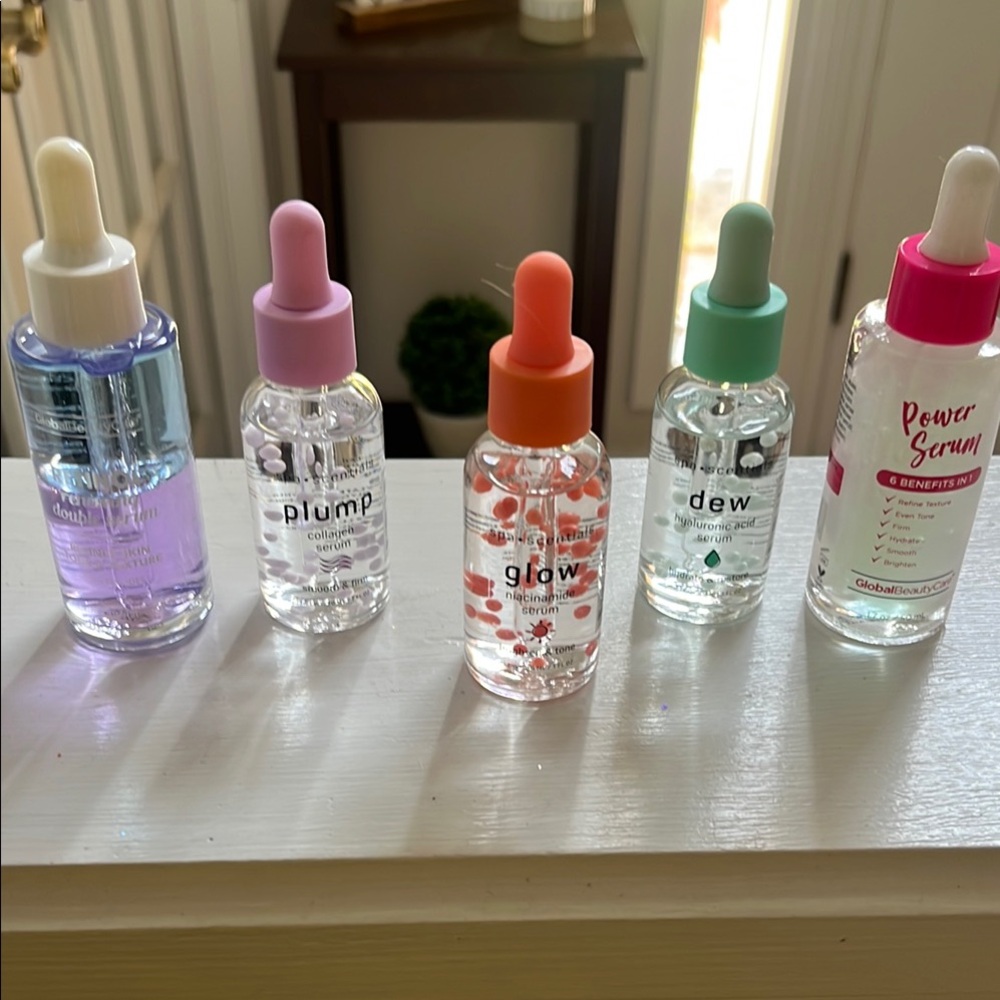 Set of Skincare Serums with Colorful Caps. Brand new !
